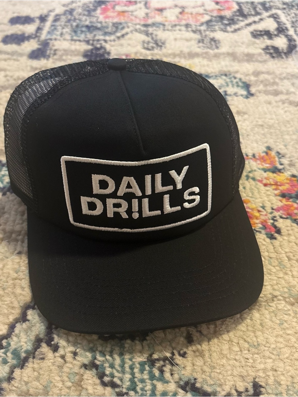 Daily Drills Black Trucker Hat — Embroidered Logo Cap